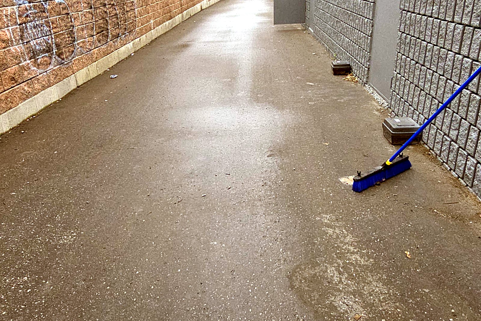 The same laneway swept clean from end to end